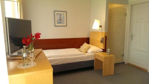 En eller flere senge i et værelse på Hotel Fernsicht