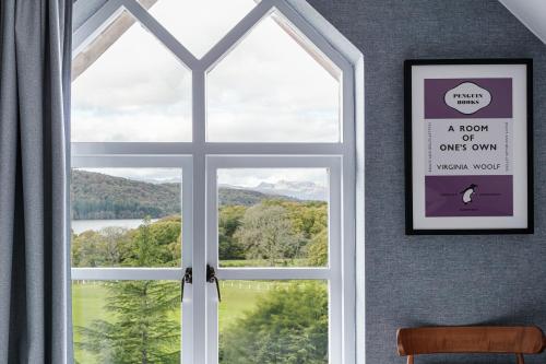 a window with a view of a mountain view at Craig Manor in Bowness-on-Windermere