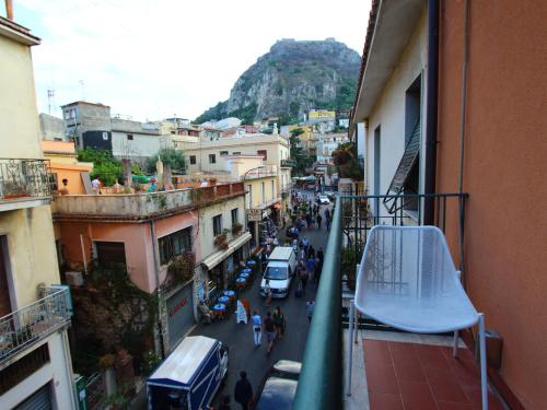 a view of a city street from a balcony at Innpiero in Taormina