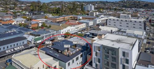 an aerial view of a city with a red circle at Inner City Apartments - 1 in Nelson