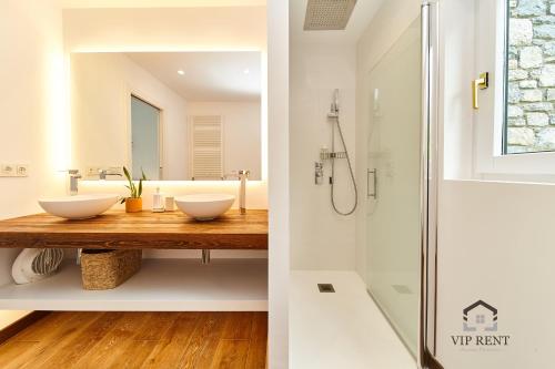 two images of a bathroom with a shower and a sink at Chalet el Salze 10 pax in La Massana