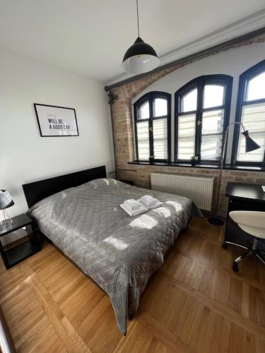 Katil atau katil-katil dalam bilik di Apartamenty Dekora