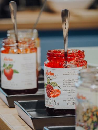 a jar of jam with a spoon in it on a counter at Levy's Rooms & Breakfast in Salzburg