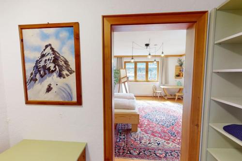 a room with a door leading to a living room at Haus Alberto - Haus mit 2 Ferienwohnungen in Ötztal-Bahnhof