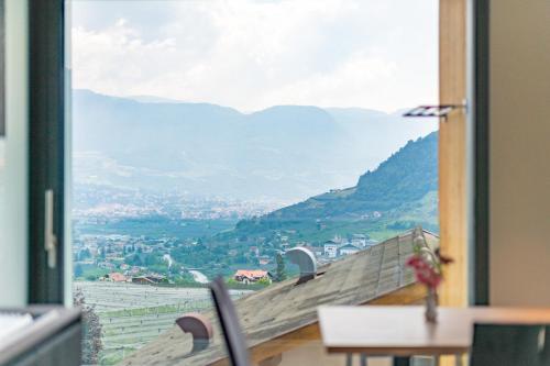 a room with a window with a view of a mountain at Plarserhof in Lagundo