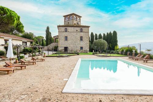 a building with a swimming pool in front of a building at I Segreti del Borgo in Penna in Teverina