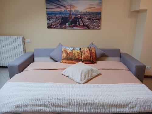a large bed with two pillows on top of it at La Torretta - incantevole appartamento nei colli Berici in Nanto