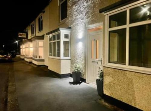 a row of buildings on a street at night at The Graph’s Gaff in Aycliffe
