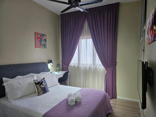 a bedroom with purple curtains and a bed with shoes on it at Oasisstay 4 Bedrooms Apartment With Studio at Bangi Sentral in Bandar Baru Bangi