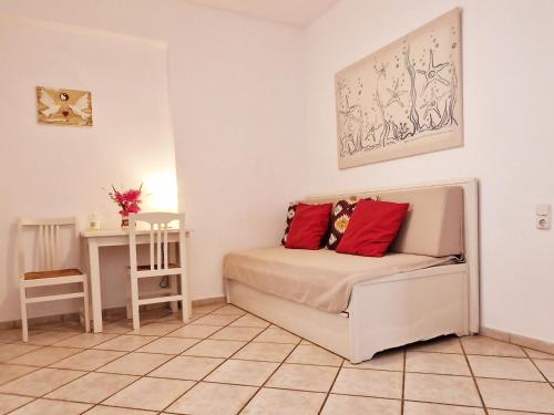 a living room with a couch and a table at Panorama Apartments Fiscardo in Fiskardho