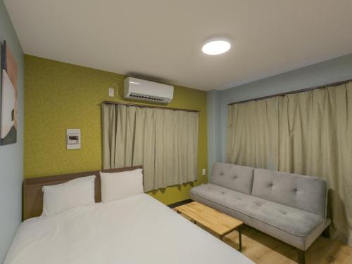 Postel nebo postele na pokoji v ubytování 殿堂