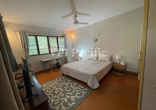 a bedroom with a bed and a ceiling fan at Jacuzzi Pool Villa Isabelle 1bed in Nathon Bay