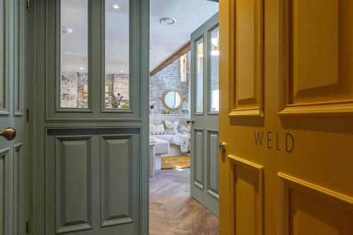 a door to a hallway with a view of a living room at Shirehall Apartments in Holt