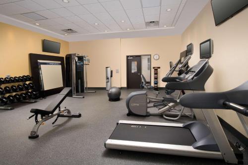 a gym with several treadmills and exercise machines at Hampton Inn Huntsville/Village of Providence, AL in Huntsville