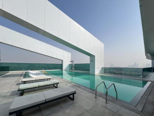 a swimming pool on top of a building at 2BR 1 Residences Zabeel with Sleeps 5 - Luxury Stay in Dubai