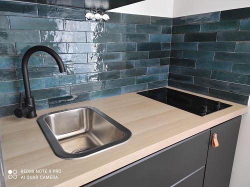 a kitchen with a sink and a counter top at Studi'Hotel cœur Sablettes CLIM parking H24 total autonomie in La Seyne-sur-Mer