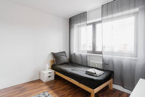 a room with a bench in front of a window at MaliDu Apartment Krefeld Düsseldorf in Krefeld