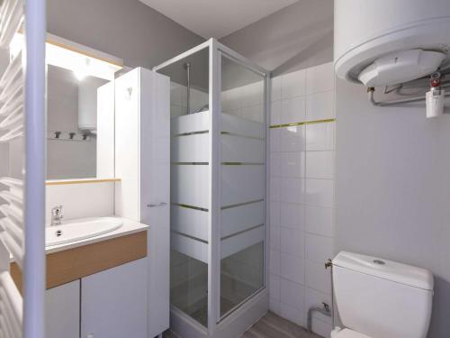 a bathroom with a shower and a toilet and a sink at Studio Gourette, 1 pièce, 3 personnes - FR-1-400-12 in Gourette