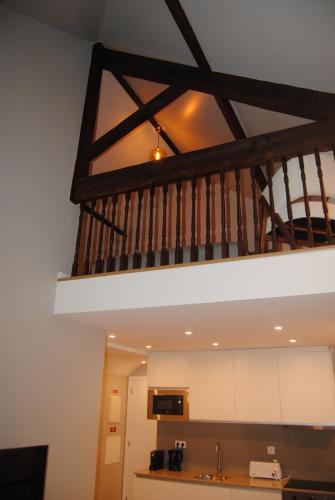 a kitchen with a staircase in a house at Gaia Loves You - Jardim do Morro in Vila Nova de Gaia