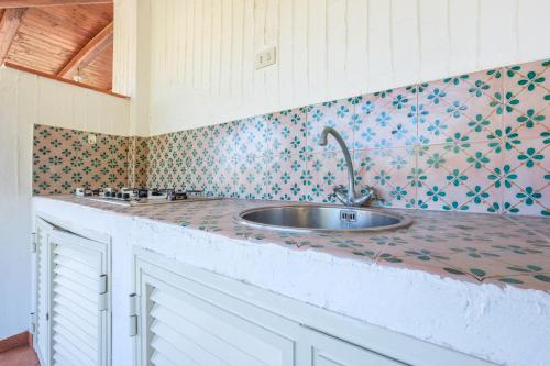 a kitchen with a sink on a counter at Jera suite vista mare 2 in Vulcano