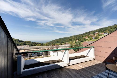 a balcony with a view of the mountains at Schwarzwaldtraum in Sasbachwalden