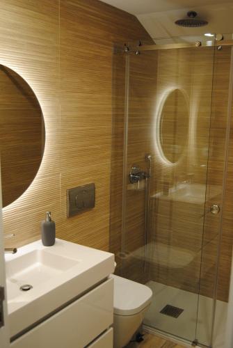 a bathroom with a shower and a toilet and a sink at Gaia Loves You - Jardim do Morro in Vila Nova de Gaia