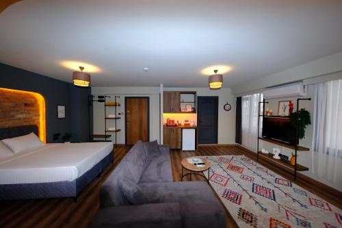 a living room with a bed and a couch at Karaköy in Karaköy Hotel in Istanbul