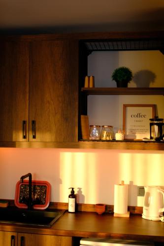 a kitchen with a counter top with a shelf at Karaköy in Karaköy Hotel in Istanbul