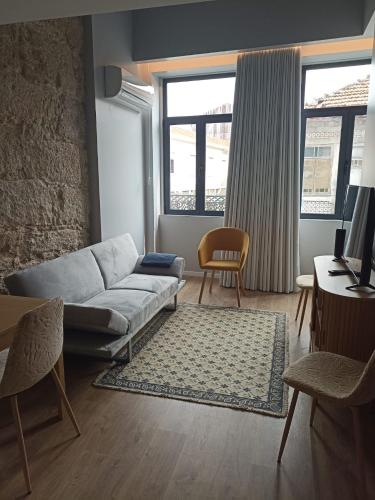 a living room with a couch and a table at Gaia Loves You - Jardim do Morro in Vila Nova de Gaia