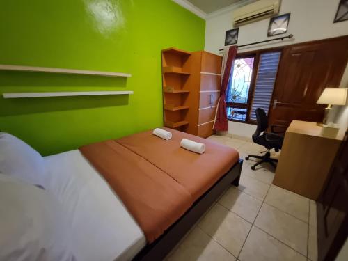 Postel nebo postele na pokoji v ubytování House of Scorpio Timoho