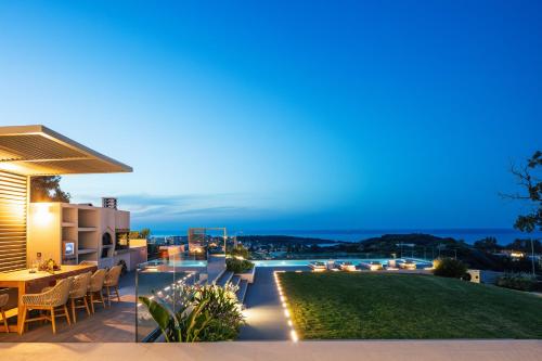 a villa with a view at night at Centro Golden View Villa in Chania