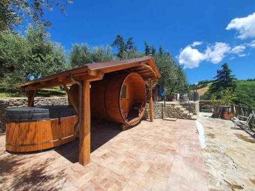a wooden play house with a gazebo at Re Piano appartamento I Fiori in Modigliana