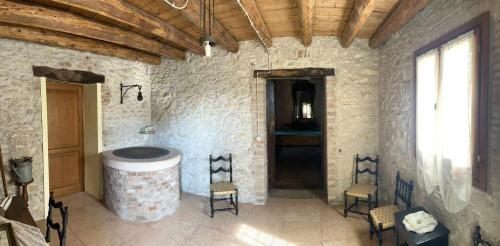a large room with a barrel and chairs in it at Villa San Biagio Residence in Mason Vicentino