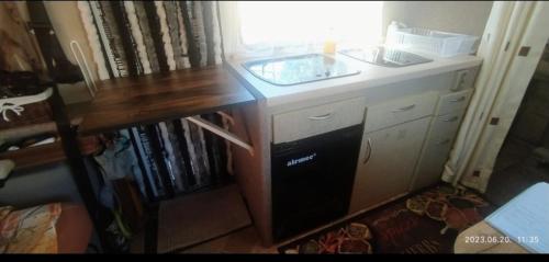 a kitchen with a sink and a counter top at Motorhome in Los Cristianos