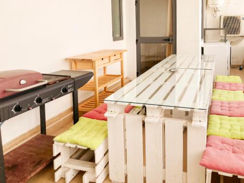 a room with a table and some chairs in it at XL Central Home - Sleeps 10 people in Pieta