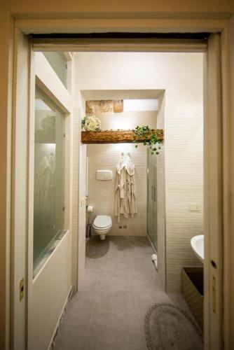 a bathroom with a toilet and a sink at B&B EHM in Barletta