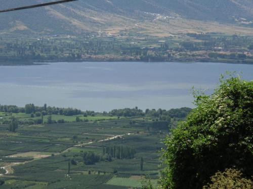 a view of a body of water from a hill at Nimbus Guesthouse in Kastoria