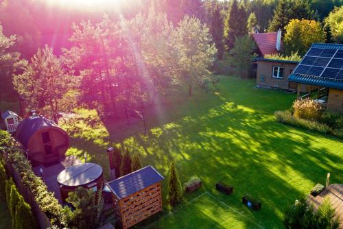 an aerial view of a yard with a solarium at Winiec Family Houses in Winiec