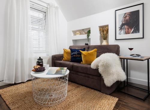 a living room with a couch and a table at Central Plymouth 1 Bedroom Apartment - Sleeps 5 - Habita Property in Plymouth