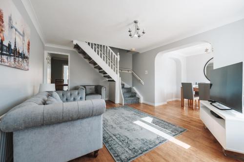 a living room with a couch and a television at Stylish spacious home in Redcar in Redcar