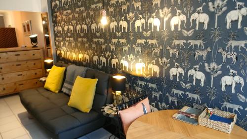 a living room with a couch and a table at Daiches Braes Brunstane Portobello in Edinburgh