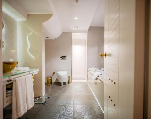 a bathroom with a sink and a toilet in it at DoubleTree by Hilton Izmir - Alsancak in Izmir