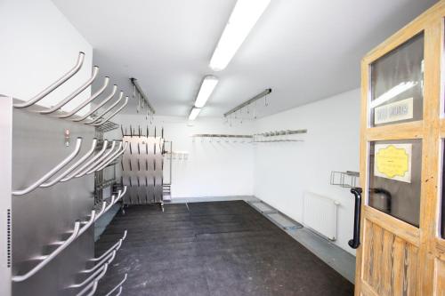 an empty room with a row of seats and a door at Apartments Telemark Kranjska Gora in Kranjska Gora