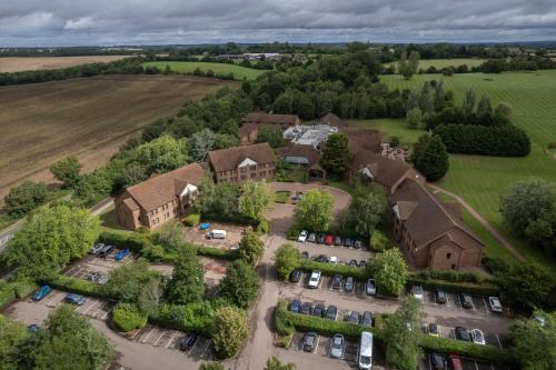 an aerial view of a house with a yard at Stratford Manor Hotel in Stratford-upon-Avon