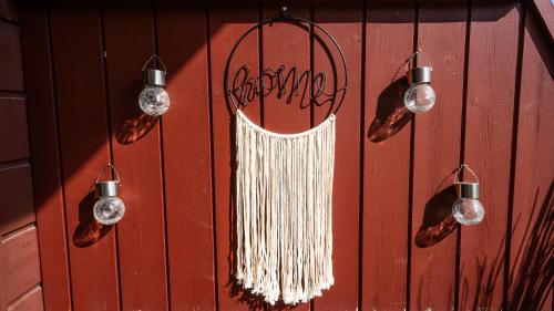 a wall with a string of hanging lights and a dream catcher at Appartement Stelo Gosau-Hallstatt in Gosau