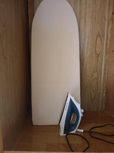 a blue item sitting on a table next to a whiteboard at Backpack Cabin A 49149 in Oranjestad