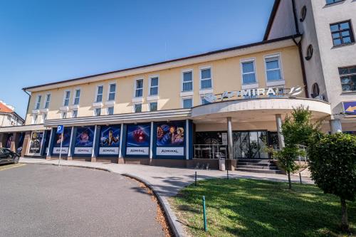 a building with posters on the side of it at Casino & Hotel ADMIRAL Ptuj in Ptuj