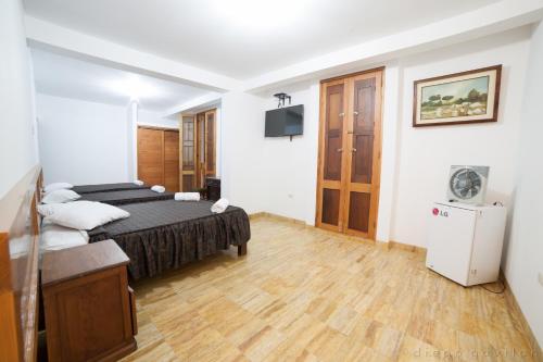 Postel nebo postele na pokoji v ubytování Hotel El Huarango