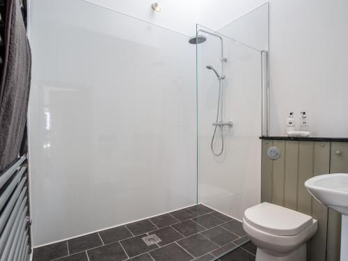a bathroom with a shower and a toilet and a sink at Long Barn - Ukc2870 in Baltonsborough