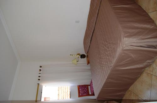 Ein Bett oder Betten in einem Zimmer der Unterkunft Hotel São Luiz